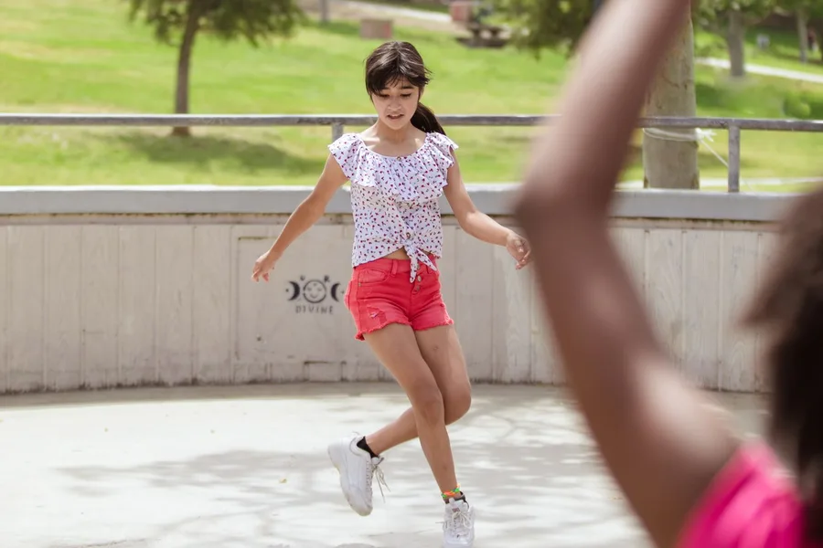 Children enjoying an outdoor skating activity together.