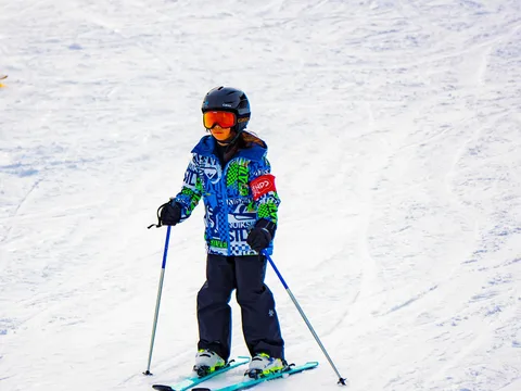 Young skier on a snowy slope in Yuzawa, Japan.